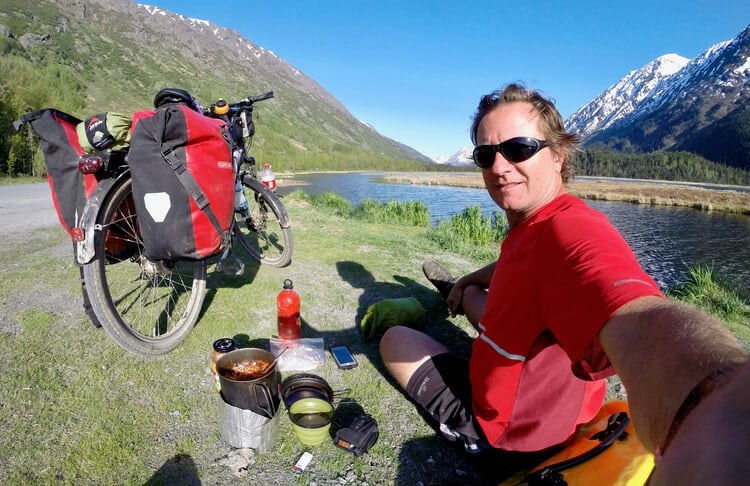 Using an alcohol stove for a quick roadside meal while Bicycle Touring in Alaska